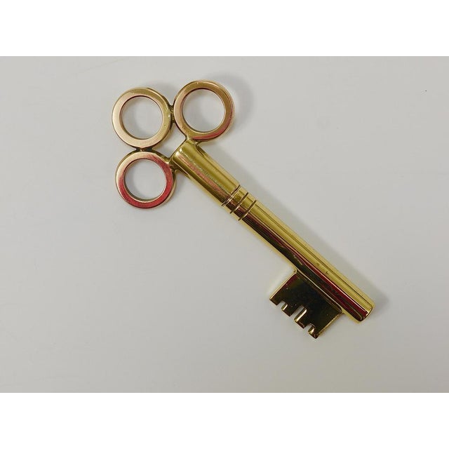 A beautiful sculptural Mid-Century cork screw bottle opener in the shape of a big key. This is a rare and not common...