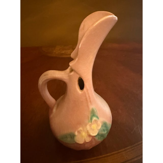 The Roseville Mock Orange Pink 1950 Vintage Mid Century Modern Pottery Ewer 916-6 is a unique and stylish piece of...