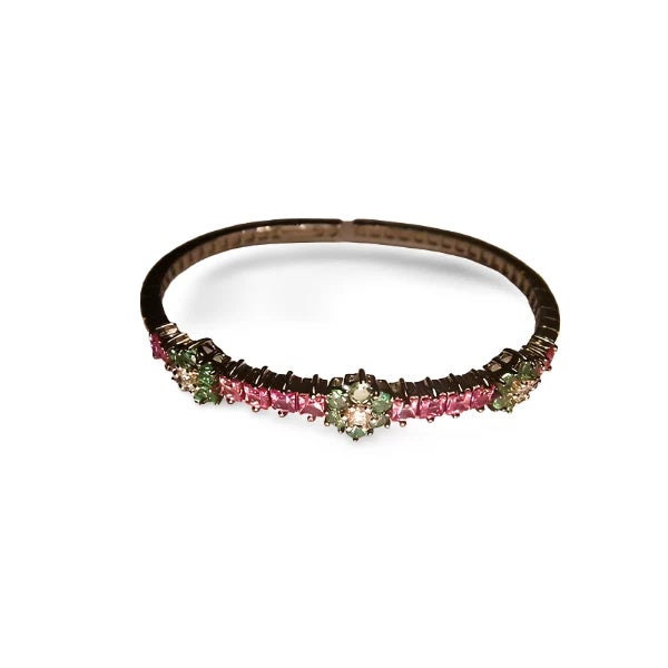 This elegant estate 18K white gold bangle features a stunning combination of 12 princess-cut pink sapphires 3 carats, 18...