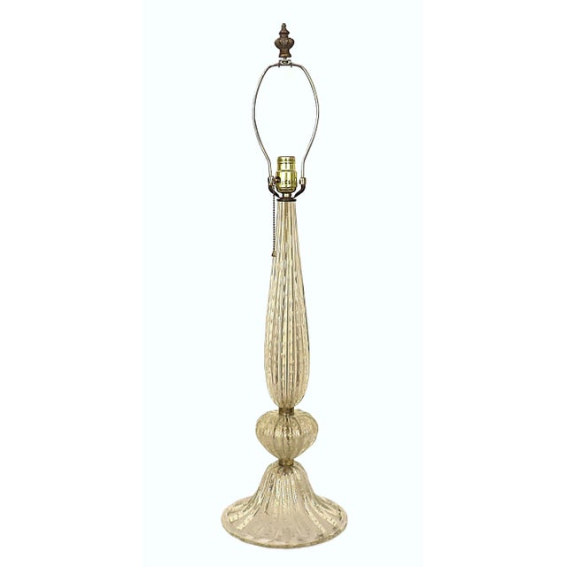 FREE SHIPPING ANYWHERE IN THE CONTINENTAL US! This is a vintage statuesque gold Murano glass table lamp with silk shade....
