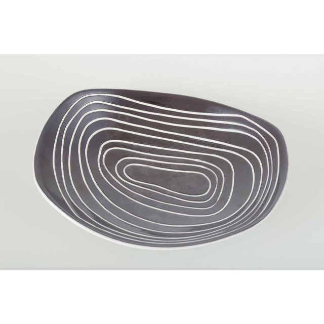 Hjördis Oldfors for Upsala-Ekeby Bowl, model 5071, 1960s. Asymmetrical faience bowl with white glaze on the exterior and...