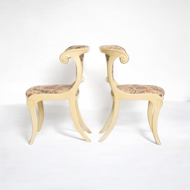 Love these! This is a set of four Italian Klismos style painted side chairs. The upholstery is vintage with no holes and...