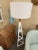 Tanner floor lamp is white hot with a hand-textured steel frame base and natural brass hardware accents. The oversized...