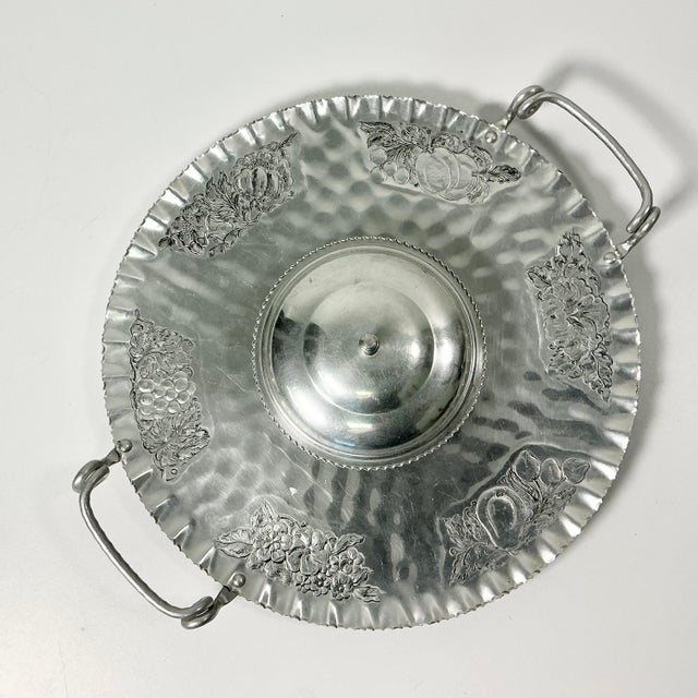 This 1950s Aluminum Serving tray is hand-wrought and etched with botanicals leaves, vines and fruit. It has two large...