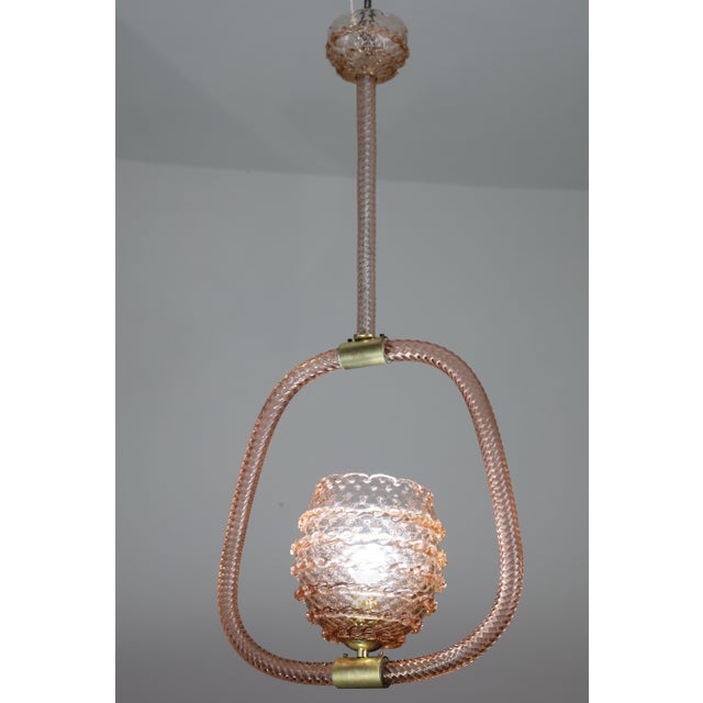 Stunning Murano chandelier worked glass, extremely rare for its pink color. The chandelier is certainly attributed to the...