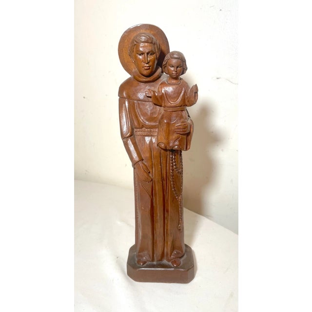 Up for sale is a wonderful vintage hand carved wooden baby Jesus and Saint Joseph sculpture. It's carved with a lovely...