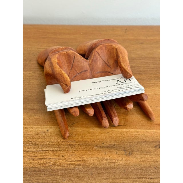 "Hand" out your business cards with this carved vintage solid wood holder. The quirky design will make your business cards...