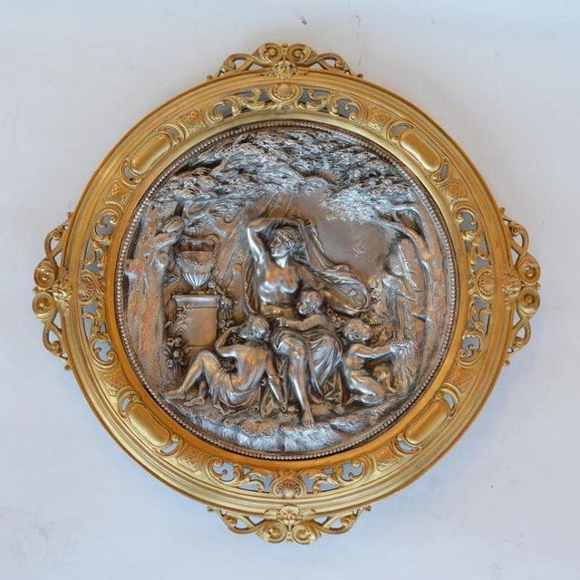 A striking pair of late 19th century Italian deep relief wall plaques featuring finely detailed classical figural scenes...