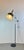 Stunning floor lamp made of black lacquered metal, chromed steel, and a textured resin diffuser. this fully adjustable...