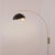 The Luna Bella Wall Arc Lamp is a striking arc lamp featuring a weathered brass steel body and a matte black and gold...