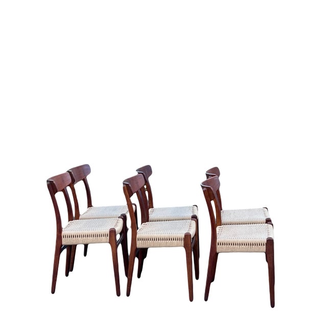 A stunning set of original and fully authenticated Mid-20th Century Hans Wegner Model CH-23 Teak and Rush armchairs...