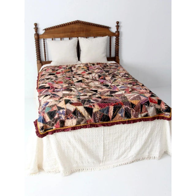 A rare double sided patchwork crazy quilt circa 1890. Hand-stitched at the turn of the century, the quilt features "crazy"...