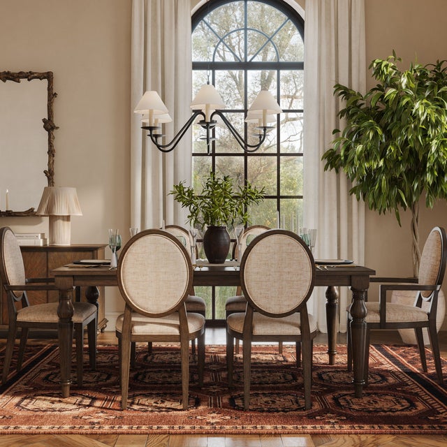 The Mila Dark Brown Wood Extendable Dining Table combines timeless charm with practical functionality. Finished in a deep,...