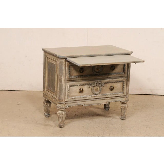 A vintage Neoclassic style painted wood two-drawer side chest from Italy. This small sized chest from Italy, circa late...