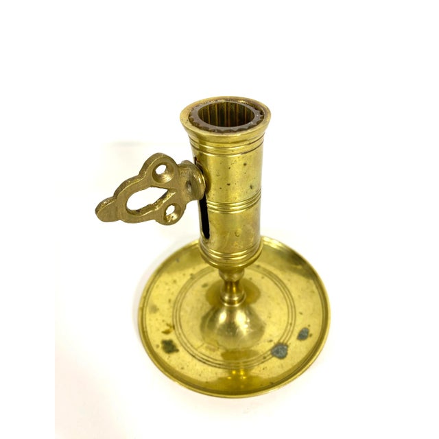 Single solid brass push up candle holder with a turn key on the side to adjust the height of the candle. This holds a...