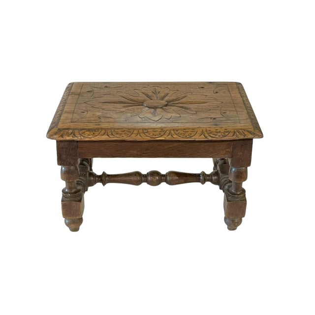 Small size antique French provincial carved oak stool or riser. Central carved flower with carved detailing all along the...