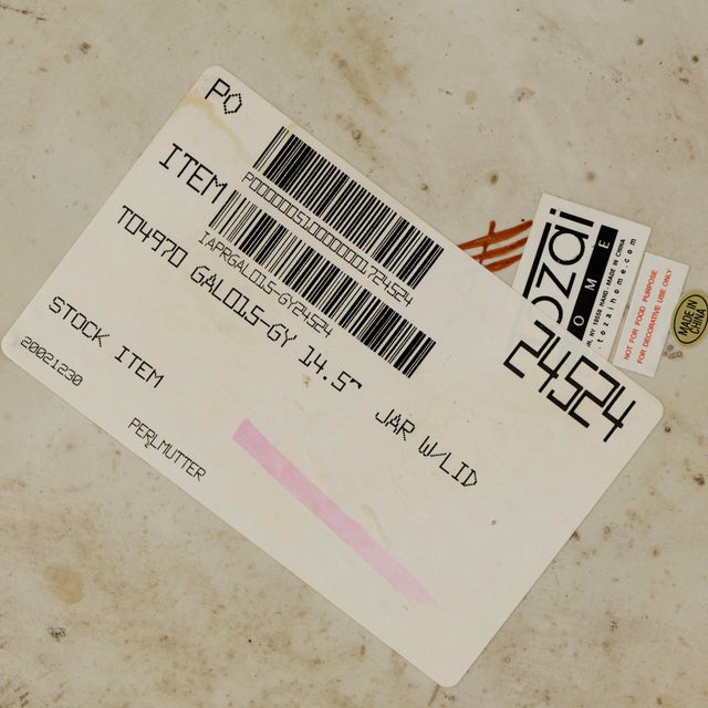 This striking pair of large lidded vessels by Tozai showcases a refined modern aesthetic enhanced by a richly textured...