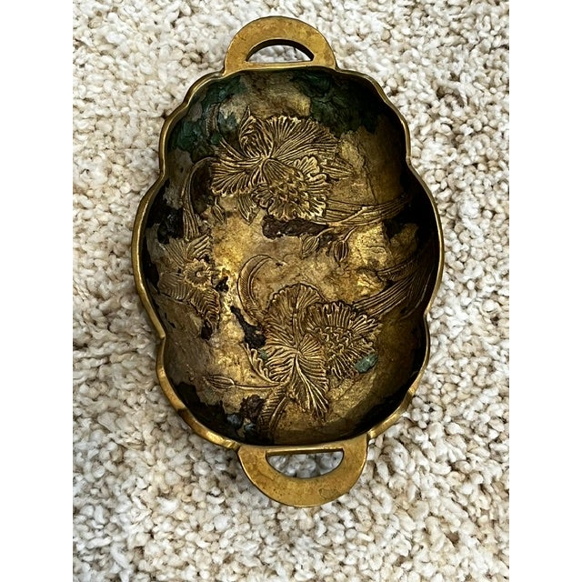 Art Nouveau design from the late 19th or early 20th century, which often features flowing lines and natural flower motifs....