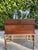 A pair of patinated cast metal monkey sculptures with richly textured surfaces and an aged verdigris finish. The set...