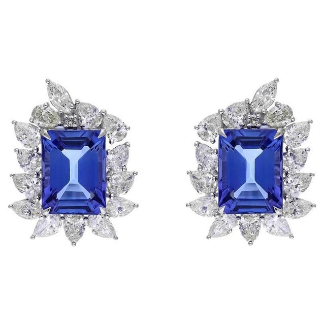 diamonds 1.06cts tanzanite 10.16cts gold 7.49gms It’s very hard to capture the true color and luster of the stone, I have...
