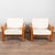 Circa 1960 pair of large rustic pine armchairs featuring heavy rolled arms and substantial proportions. The solid pine...