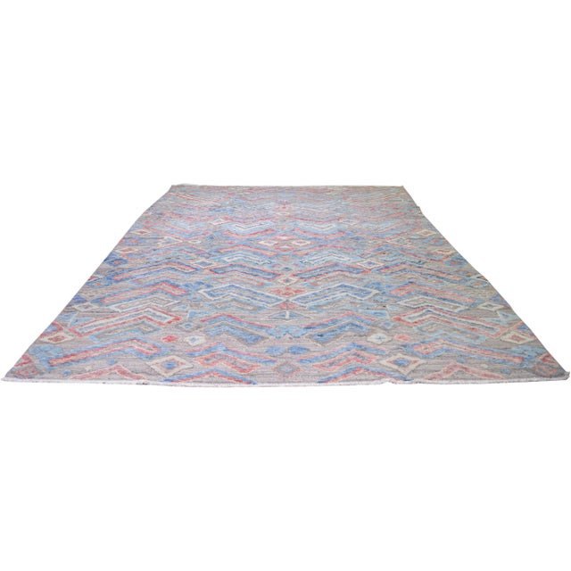 Moroccan Sheba hand knotted wool rug with primitive design.