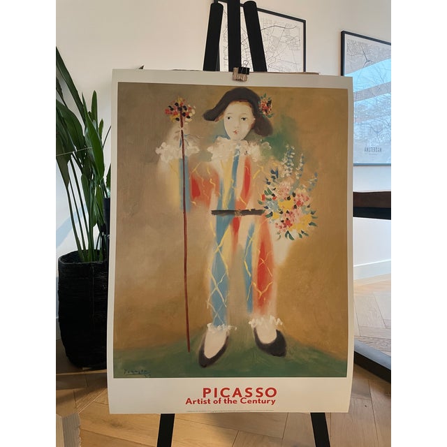 This captivating poster of Picasso's masterpiece, Le Petit Pierrot aux Fleurs, is a timeless piece of art history. Printed...
