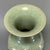 Fine antique Chinese celadon flared‑rim vase. Wide flaring opening with tall neck, body decorated with raised floral...