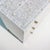 The Arabesque Mother of Pearl Inlay Three-Drawer Dresser celebrates the elegance of classical botanical ornamentation...