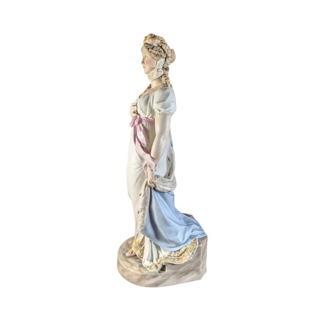This impressive figurine measures about 13.5 inches tall. A hand painted porcelain depiction of Queen Louise of Prussia....