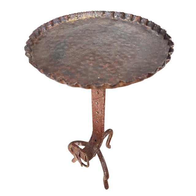 Elegant and practical - this decorative martini table was made in France in the 1960s. This table has a belt and buckle...