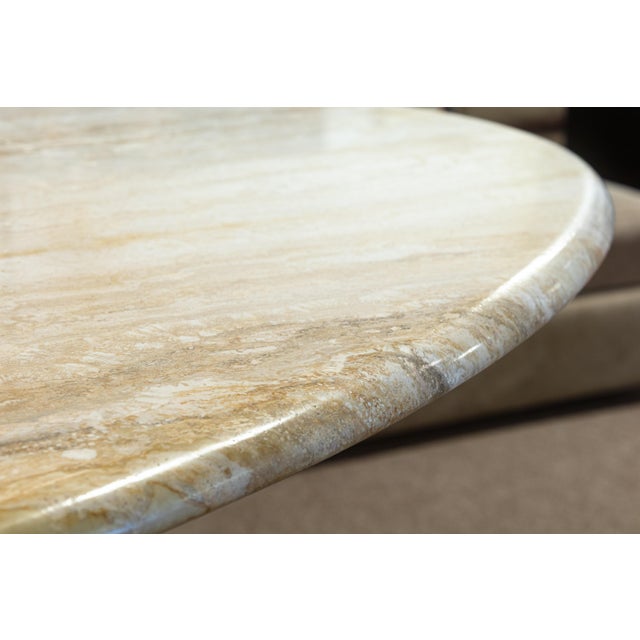 A vintage Italian travertine stone dining table. This is a gorgeous vintage dining table featuring a classic travertine...