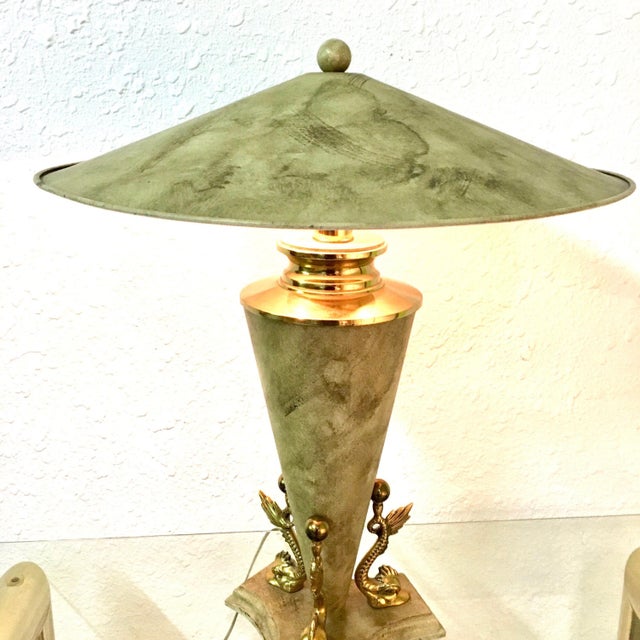 Modernist lamp has cone shaped body with 3 solid brass koi fish at the bottom., matching metal shade. The Bauer Lamp Co....