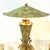 Modernist lamp has cone shaped body with 3 solid brass koi fish at the bottom., matching metal shade. The Bauer Lamp Co....