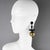 These stunning Angela Caputi, made in Italy, resin clip-on earrings feature a dangling shape with black geometric elements...