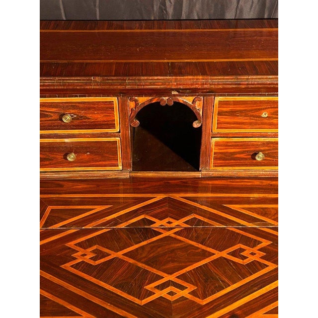 Splendid Roman fall-front desk entirely veneered in walnut wood and finely inlaid in maple wood. The piece of furniture is...