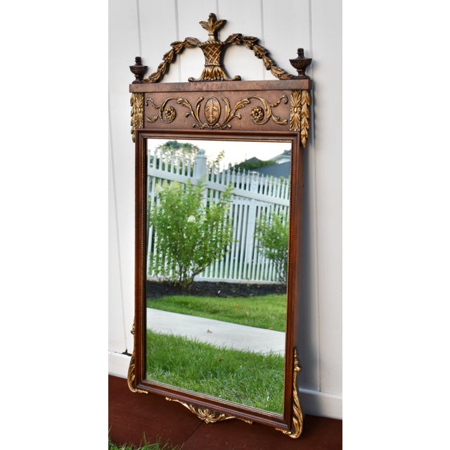 Antique (1920's) Wall Mirror has a Louis XVl Style. The Wood is Walnut with Gold Highlights. Hanging Wire for Easy Mount....
