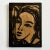 This woodcut-style portrait radiates bold attitude and graphic allure, carved with sharp contrast and expressive...