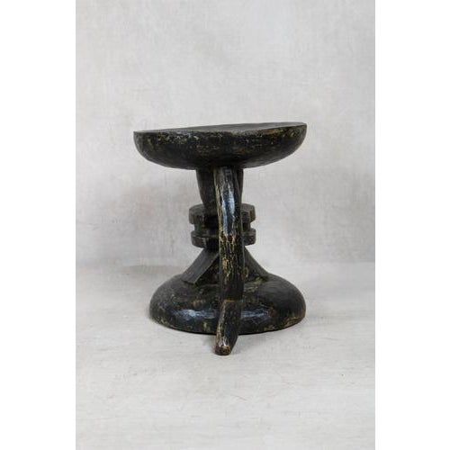 An authentic hand-carved tonga stool hand-carved from a single piece of wood, each tonga stool is a genuine artisan piece...