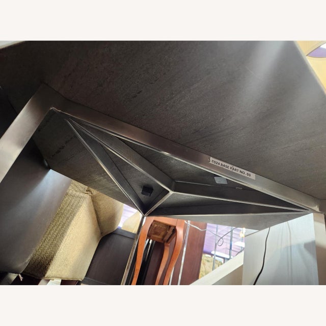 Metal/stainless steel base grey marble top. In good condition. Only one small chip to the corner (picture #3). NO BRAND,...