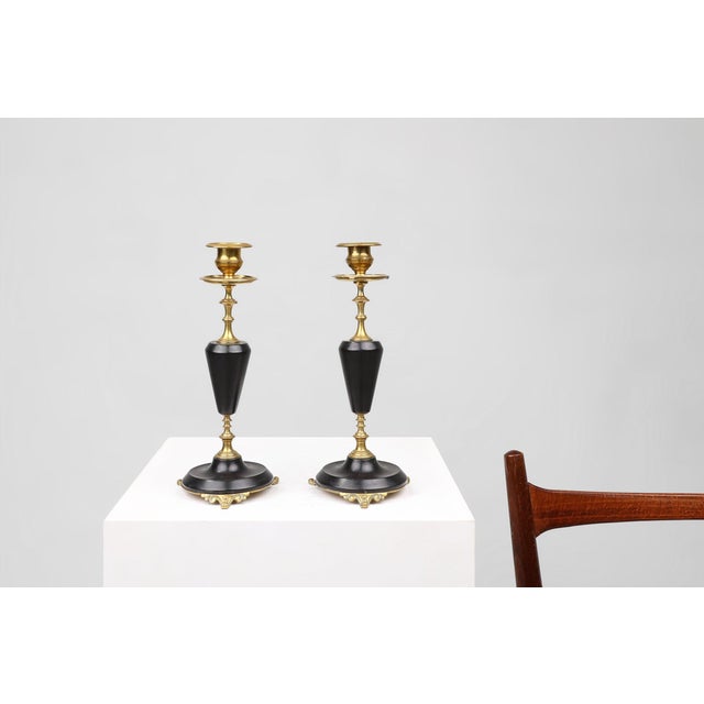 This pair of French Empire candlesticks from around 1870 exemplifies the refined neoclassical taste of the late 19th...