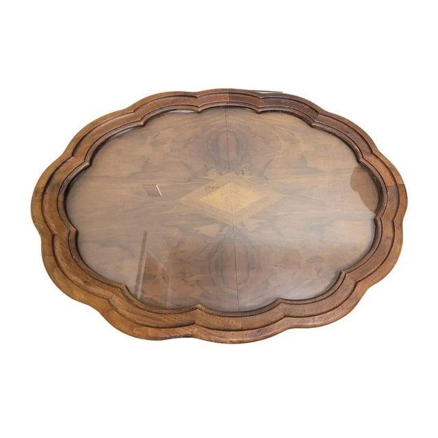 A 1950s Rococo Style Carved Walnut Glass Tray Top Oval Side Table in good vintage condition. Measures 29" in width, 22" in...