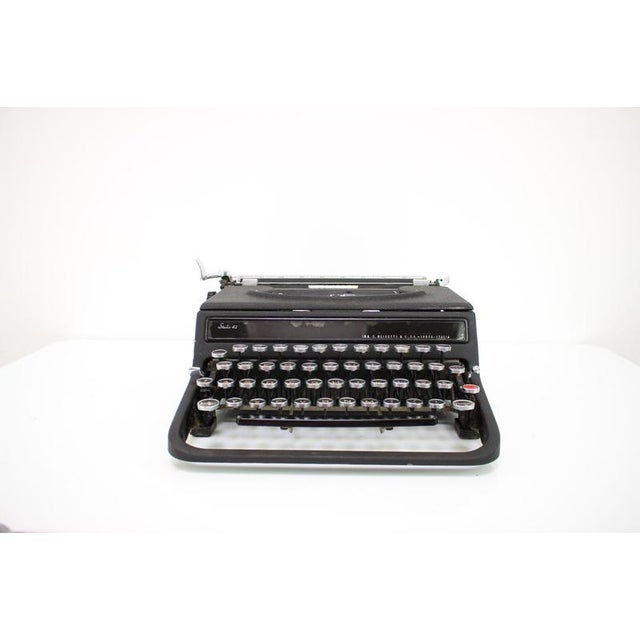 Made in Italy in the 1940's by Olivetti. Made of plastic, chrome. Fully functional, re-polished, in original condition...