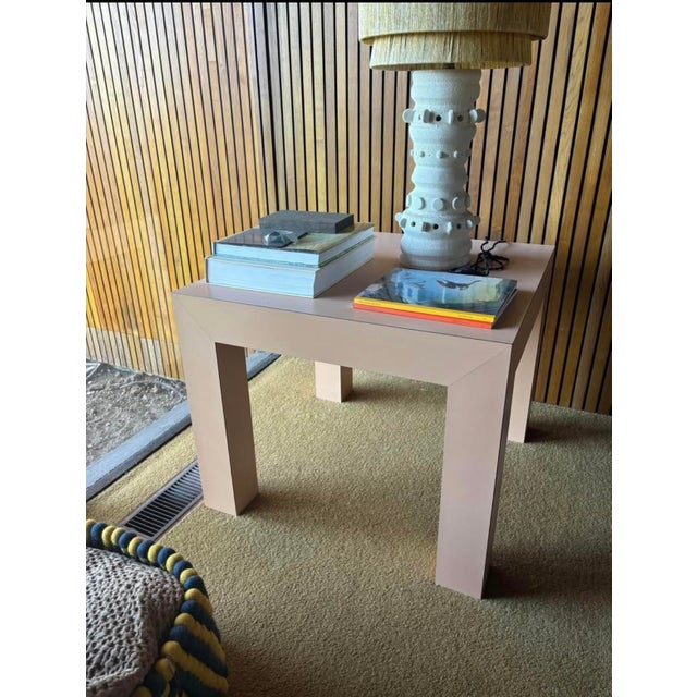 Light pink laminate post modern side table. Very solid and heavy in weight. in great condition
