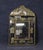 This is a gorgeous "cushion" mirror with a brass repousse ornamental frame and wood frame. The mirror dates to the early...