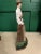 Victorian dressed lady golfer made of cast iron. She weighs approximately 3.5 pounds so she can hold back a heavy door....