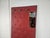 Wall coat hanger in red skai with cream colored lower edge and brass hooks. Enriched by a small side mirror. Very elegant...