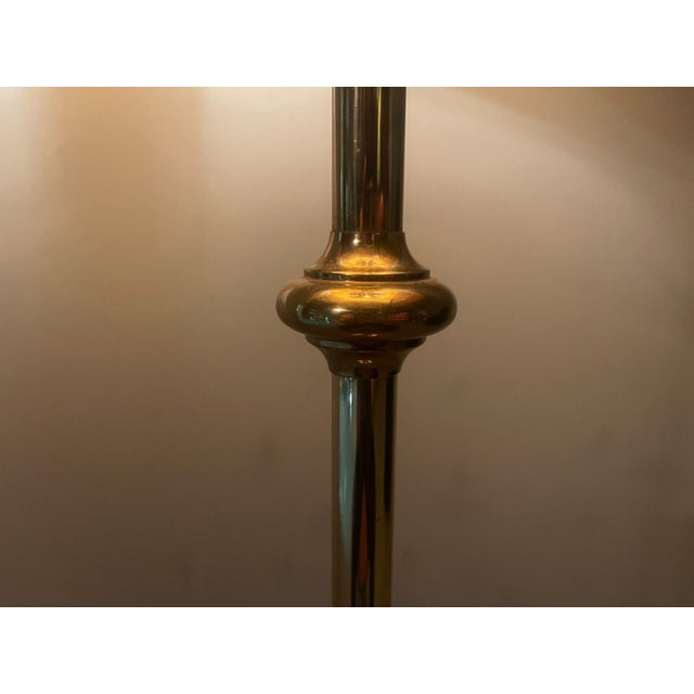 A highly distinctive french hollywood regency floor lamp dating from the 1970s, featuring an exceptionally refined brass...