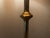 A highly distinctive french hollywood regency floor lamp dating from the 1970s, featuring an exceptionally refined brass...