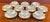 An elegant set of ten Royal Crown Derby “Marquis” Pattern A1222 cream soup bowls with matching underplates, crafted in...